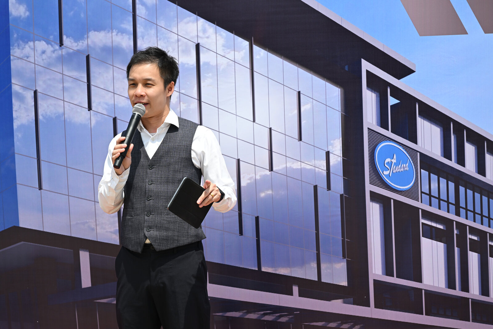 JC Cheah hosting a Standard corporate stage event
