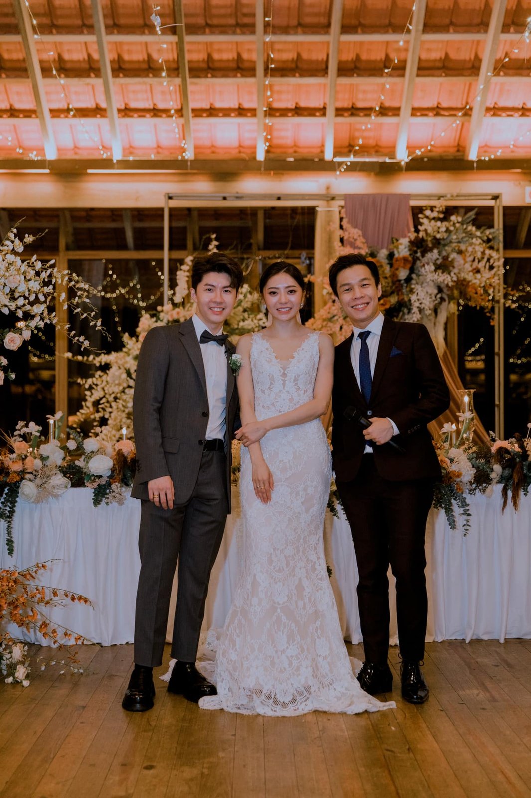 JC with a couple at their wedding