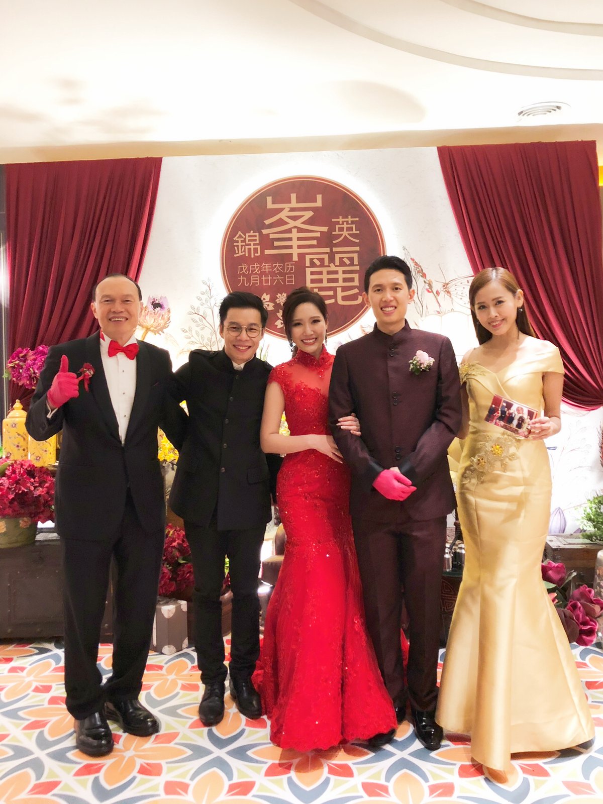 JC with a couple at their wedding