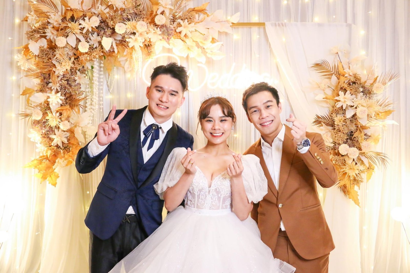 JC with a couple at their wedding
