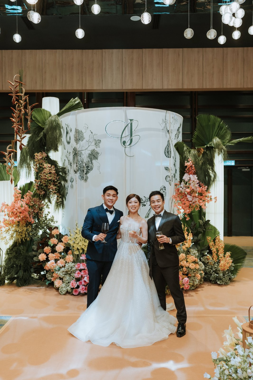 JC with a couple at their wedding