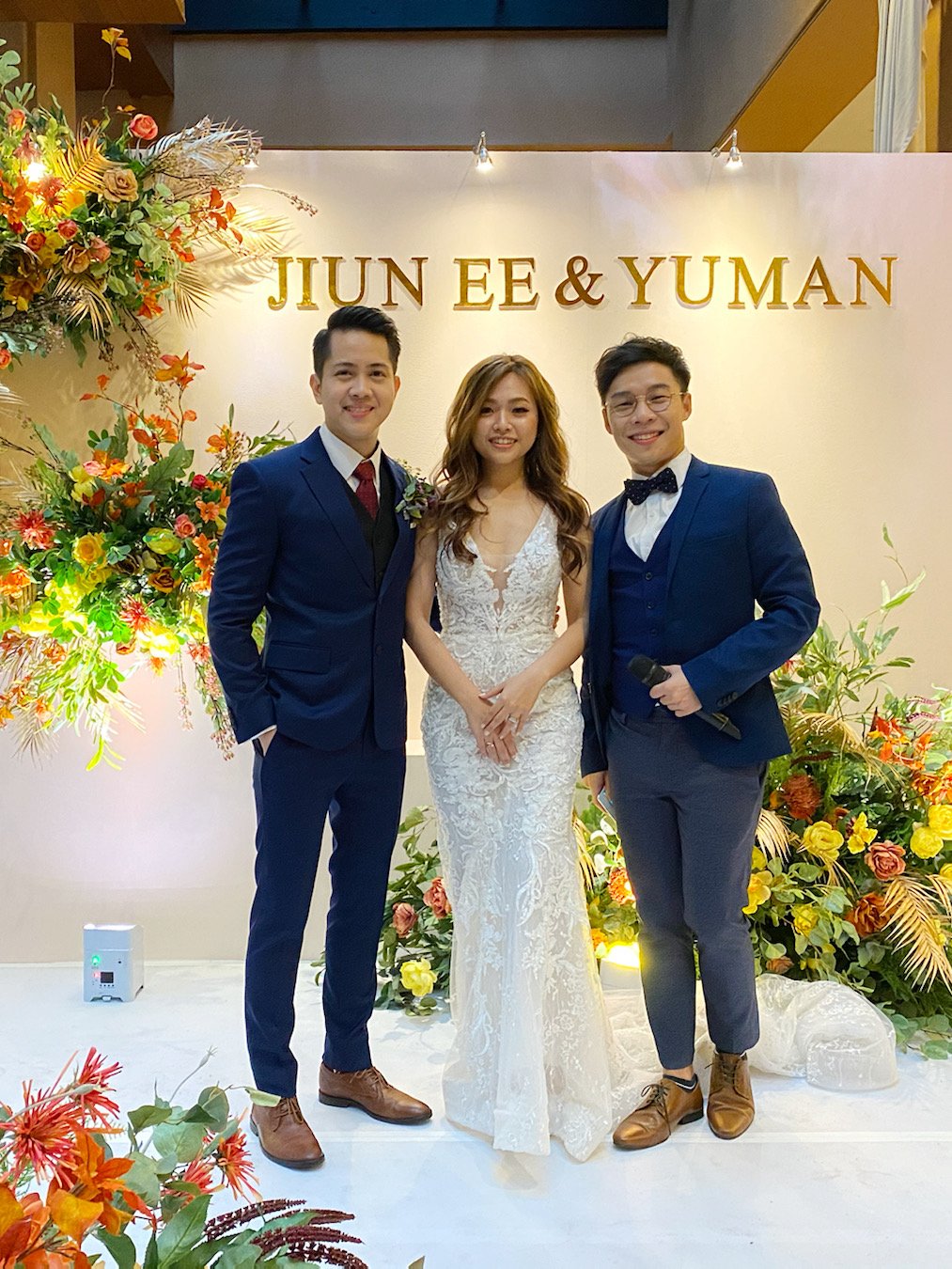 JC with a couple at their wedding