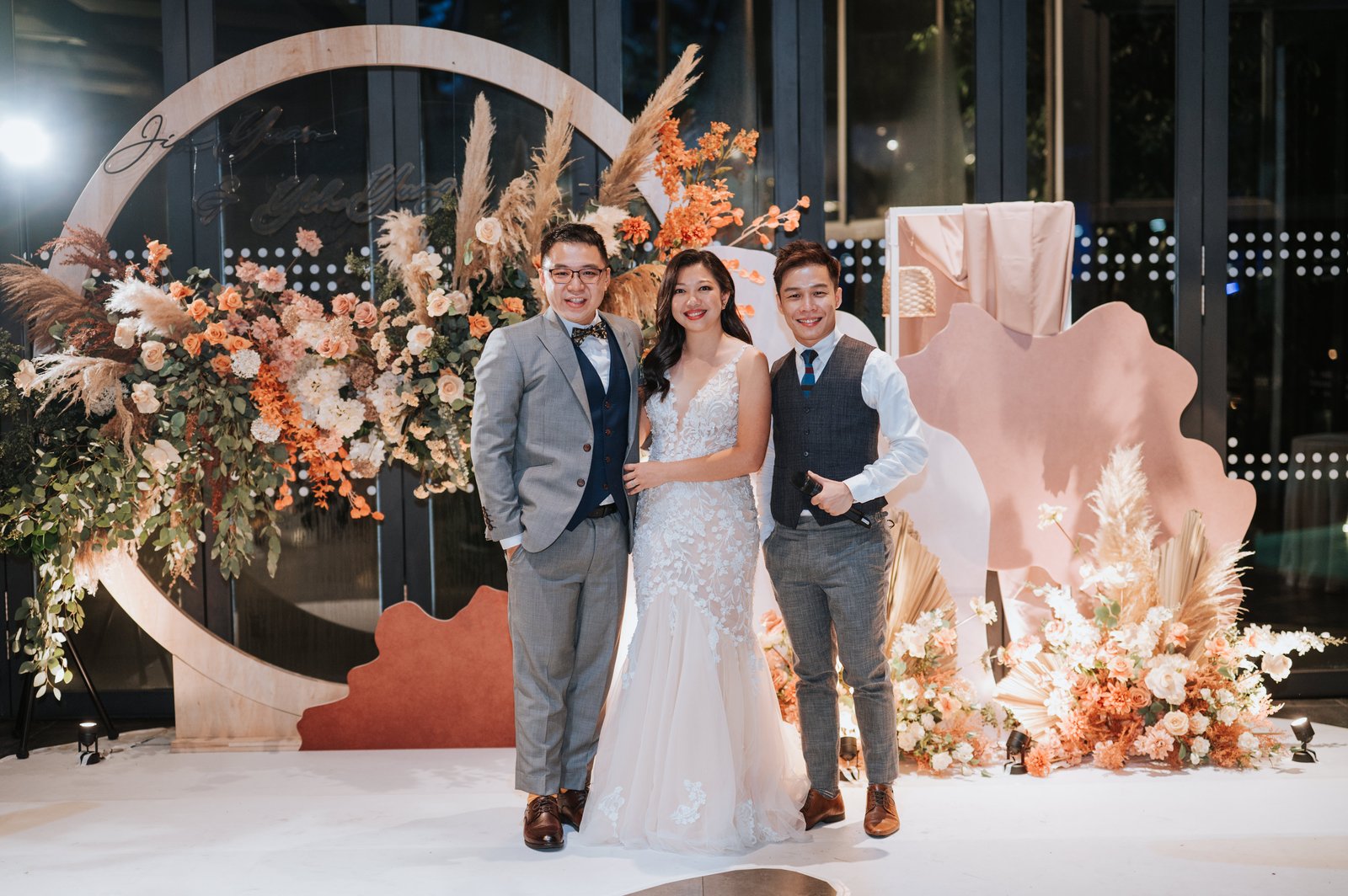 JC with a couple at their wedding