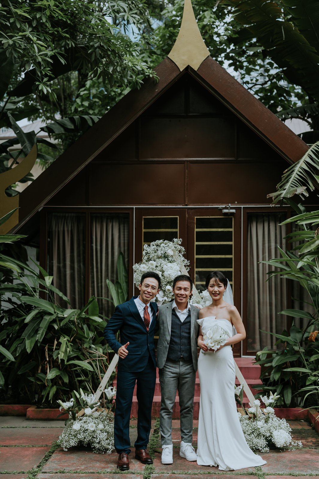 JC with a couple at their wedding