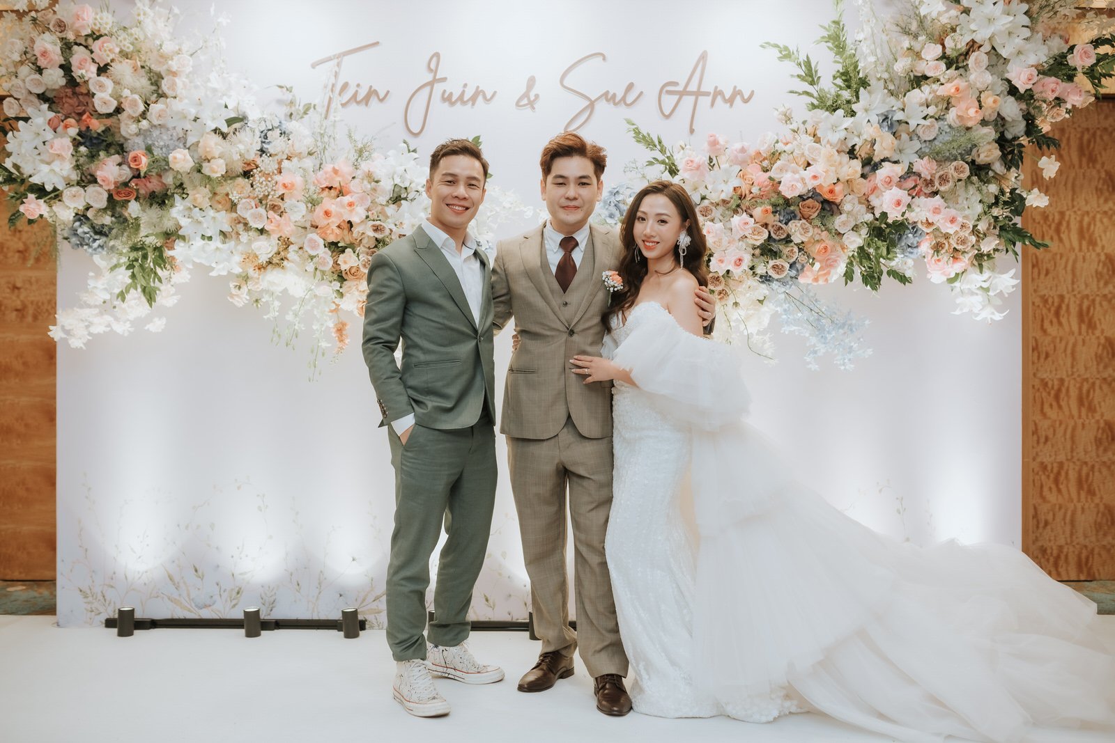JC with a couple at their wedding